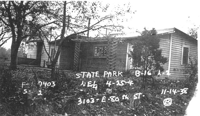 The House in the Road was built in 1907 on NE 80th Street at the corner of 31st Ave NE. Photo courtesy of the Puget Sound Regional Archives.