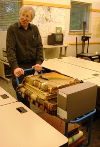 Original King County record books like these tattered journals are kept in temperature-controlled vaults at the Puget Sound Regional Archives in Bellevue. Books can be brought out on a cart to be opened in the research room, as I did to search for Keith family land transactions.