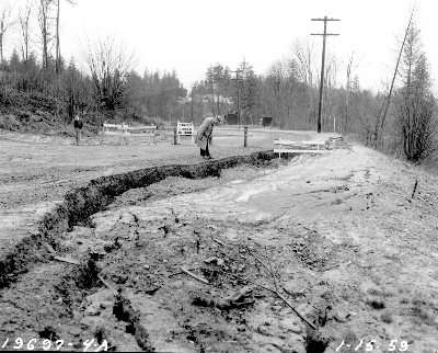 Looking west, on Paisley Drive NE near NE 88th Street, we see that water runoff has carved out a channel. Inverness Streets continued to have erosion throughout the 1950's. Photo #60496 of January 1959, Seattle Municipal Archives.
