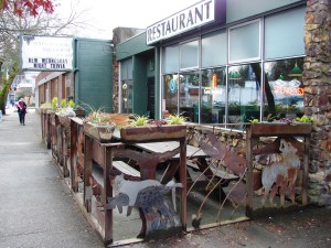 The Wedgwood Ale House at 8515 35th Ave NE is on the north end of a business building with storefronts.