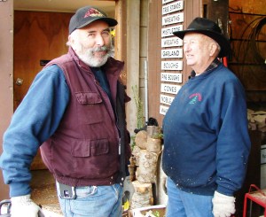 Bill Hunter Jr. with his father, William O. Hunter Sr., work together at the annual Christmas tree sales in Wedgwood.
