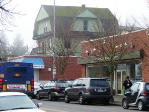 The Big Green House was hemmed in by commercial development on both sides of it.