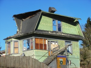 After removing the interior second floor level, the demolition shovel removed the second-floor exterior walls.