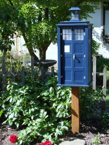 A garden setting enhances the appeal of this Little Free Library in the Wedgwood neighborhood.