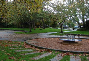 The play equipment is at the end of 26th Ave NE on Dahl Field.
