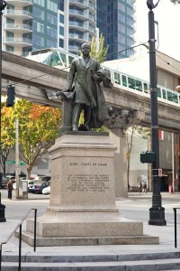 John H. McGraw Statue near Westlake Center in Seattle. The Monorail is in the background.